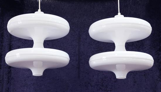 A pair of white acrylic low yo-yo ceiling lights, designed by Paul Daly, c.1999, W. 1ft